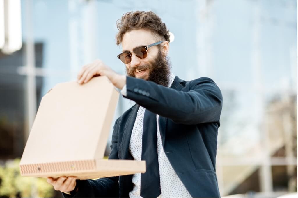 businessman-with-pizza-outdoors-picture-id1177039646 (1)